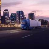Renault Trucks E-Tech T equipped with CMS (Camera Monitoring System) instead of rear-view mirrors, driving in the city at night