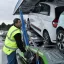 Renault Trucks driver attaching cars to be transported on a trailer