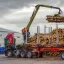 Crane placing loggs on a trailer